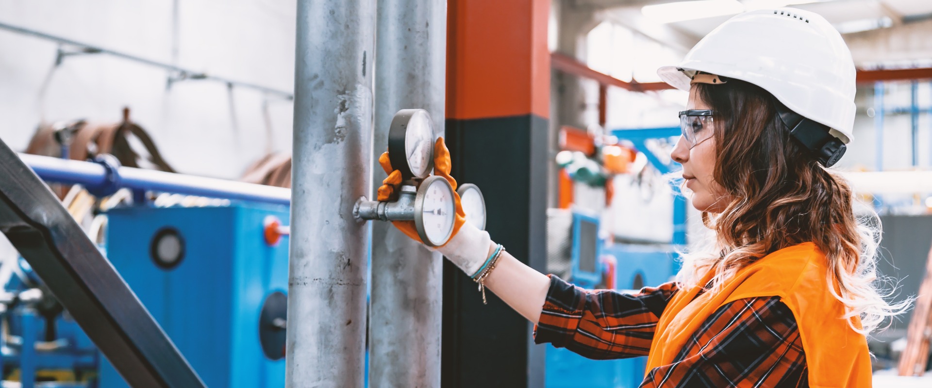 Women performing boiler maintenance check on valves